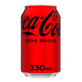 A 330ml can of Coca Cola - Zero Sugar with bold black and white labeling stands on a plain white background, emphasizing this refreshing zero-calorie beverage.